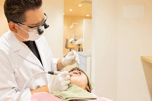 Dentist treating a patient at GrandSmile Dental Center